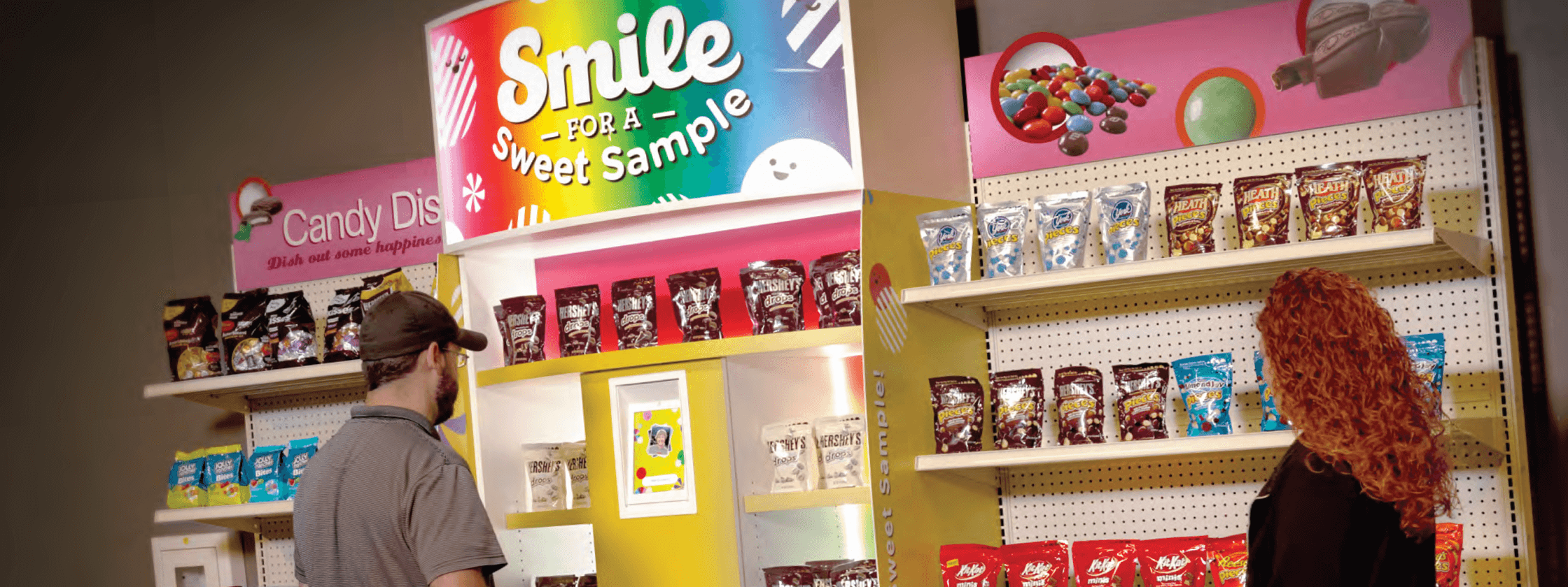 Users standing in front of the Smile Sampler prototype unit