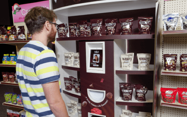 Shopper in front of Smile Sampler